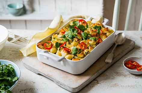 This easy pasta recipe turns a simple pasta bake into a green veggie feast. Pasta, broad beans, watercress and artichokes are all cooked in a rich and creamy mascarpone sauce with a golden halloumi topping.