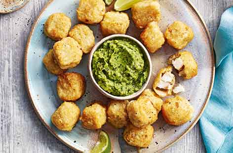 Fish nuggets with avocado and pea dip