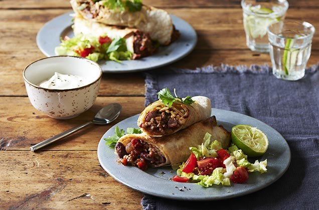 A meaty, spicy beef burrito is the perfect family dinner. Wrapped in tortillas and grilled with melted Cheddar cheese, these easy-to-prepare burritos have a hearty, beef & bean filling.