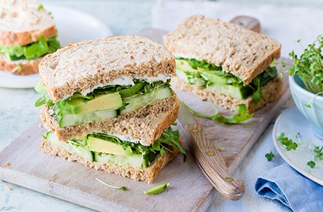 This gloriously green sarnie is sure to rouse some serious al desko lunch envy. Refreshing cucumber, salad cress, creamy avocado, peppery rocket and fragrant basil are layered up between slices of malted grain bread in this heaven-sent sandwich