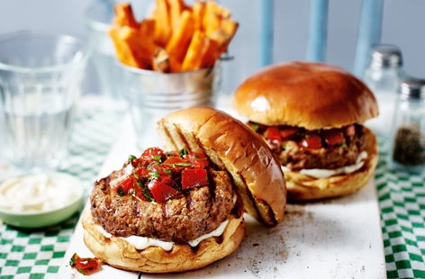 Make the most of midweek family meals with this delicious, fuss-free burger recipe. Flavoured with smoked paprika and served with a warming chilli salsa and crisp sweet potato fries, these spicy burgers are a brilliant family dinner idea