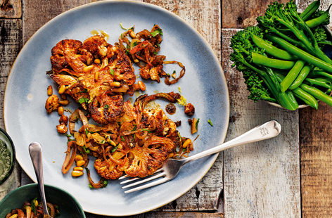 Dusted with spice and roasted until tender, cauliflower steaks are a very tasty, veggie alternative to steak. Sprinkle with pine nuts and fried shallots and serve up as a boredom-busting midweek meal