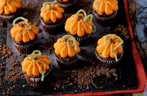 These pumpkin-inspired cupcakes are a monstrously good Halloween party treat. So easy to make, all you need to do is to pipe orange icing onto mini chocolate muffins.