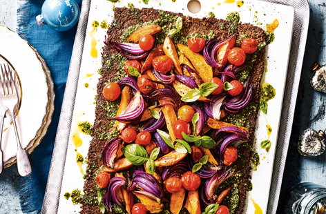 This nutty-based and gluten-free vegan vegetable tart recipe, with a fragrant pesto, is sure to be a Sunday lunch crowd pleaser.