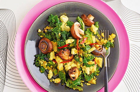 Tofu steps in to replace eggs in this clever vegan tofu scramble recipe, which is loaded with earthy mushrooms, crunchy kale and finished with a dollop of hot sauce.