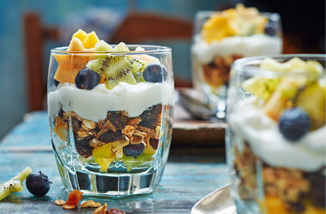 Layered with muesli, Greek yogurt and exotic fruits cut into star shapes, these pretty breakfast pots are sure to be a huge hit with your little ones