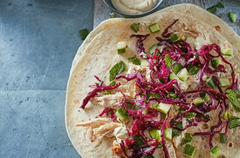 Filled with lightly pickled red cabbage, succulent chicken and tahini sauce, these satisfying chicken wraps are a delightful twist on a classic lunch dish