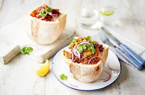 A delicious dish originating from Durban's Indian community. Rich beef curry, made with masses of cardamom, garlic and garam masala, served in a hollowed-out loaf, which soaks up the all gorgeous juices and fantastic flavours