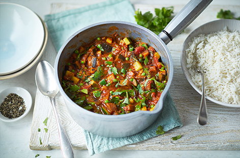 This vegan vegetable curry recipe is sure to brighten up any mealtime with its tasty combination of warming spices and vegetables, including aubergine, courgette, spinach and peas