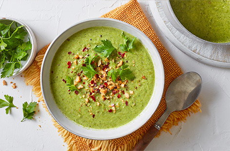 Roasting broccoli gives it a wonderful nutty flavour in this easy plant-based soup recipe. It's topped with peanuts for added crunch and a pinch of chilli flakes for extra warmth.