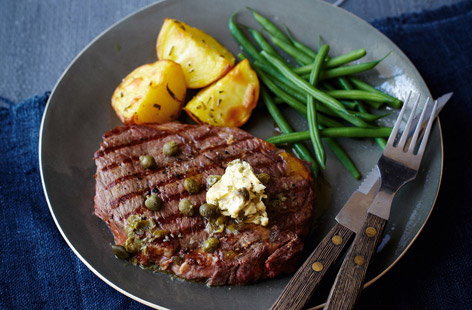 Who doesn't love steak night? Especially when accompanied by crispy rosemary potatoes, gorgeous caper butter, and crunchy green beans. The potatoes are par-boiled, then cut into small chunks to speed up their roasting time.