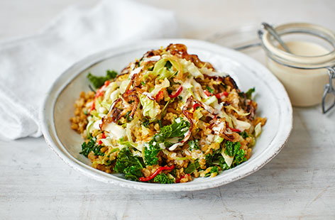 This incredibly delicious seasonal salad combines hearty grains with crispy onions, stir-fried kale and a creamy tahini and lemon dressing. Freekeh, a type of roasted wheat with a smoky, nutty flavour, works wonderfully in this dish