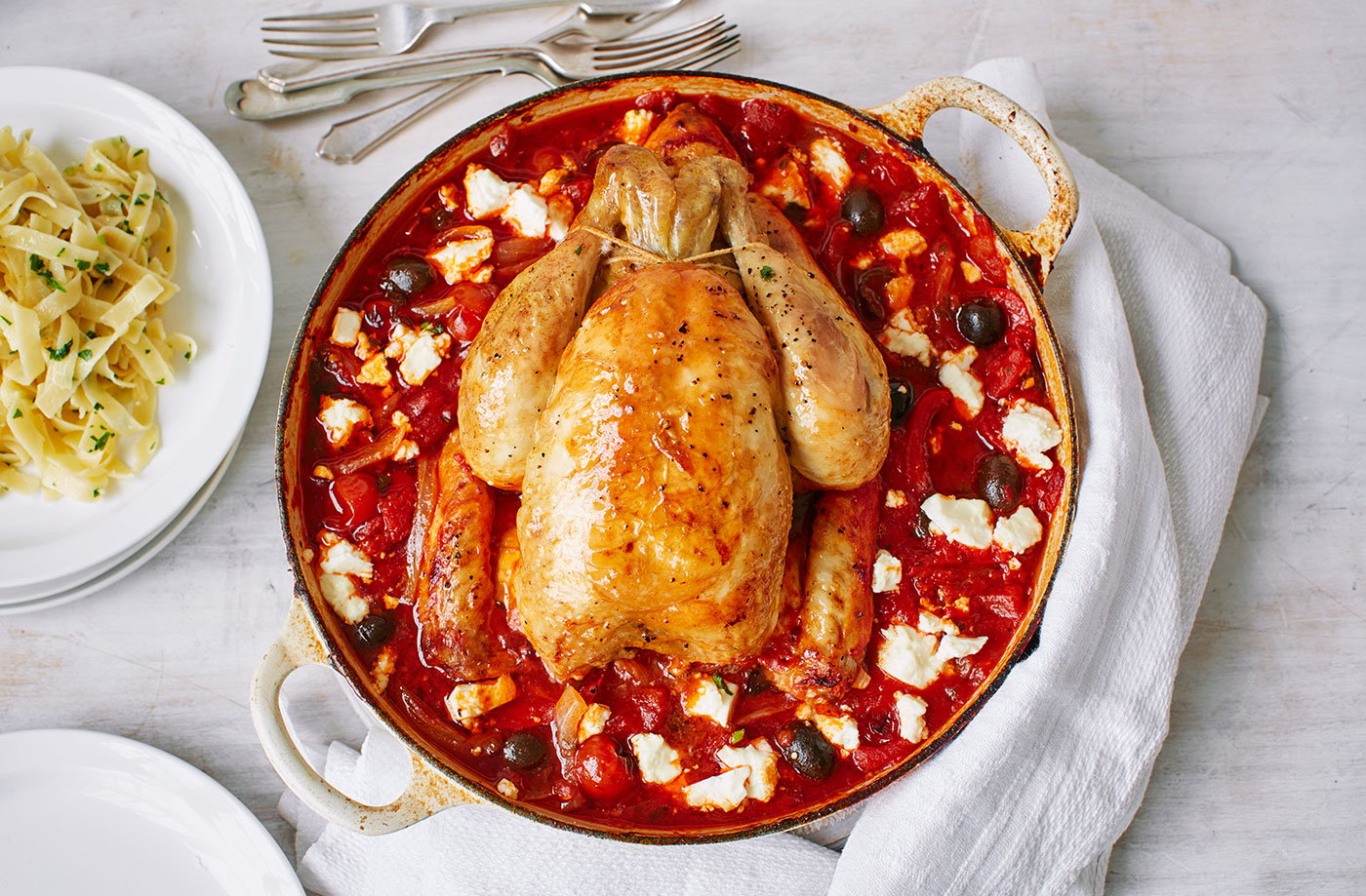 Greek chicken pot roast served with buttered tagliatelle