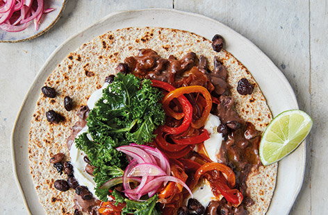 Jamie Oliver's vegetarian taco recipes with colourful veg and beans is a great Friday night feast.